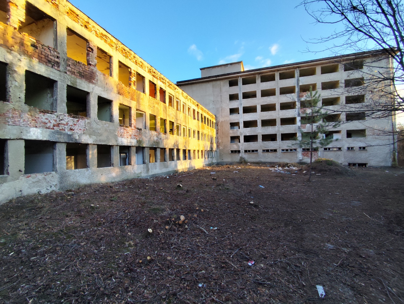 Ground-level view showing reinforced-concrete structure and building massing