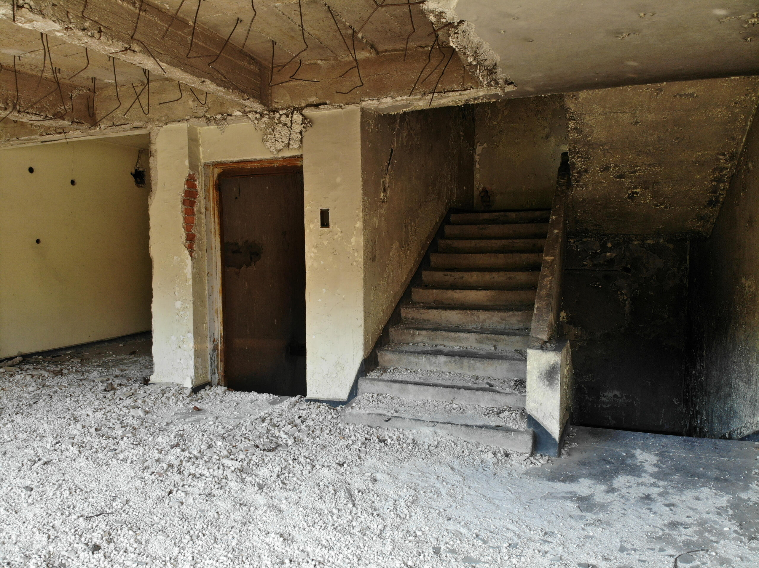 Internal staircase and circulation spaces showing concrete construction and rebar